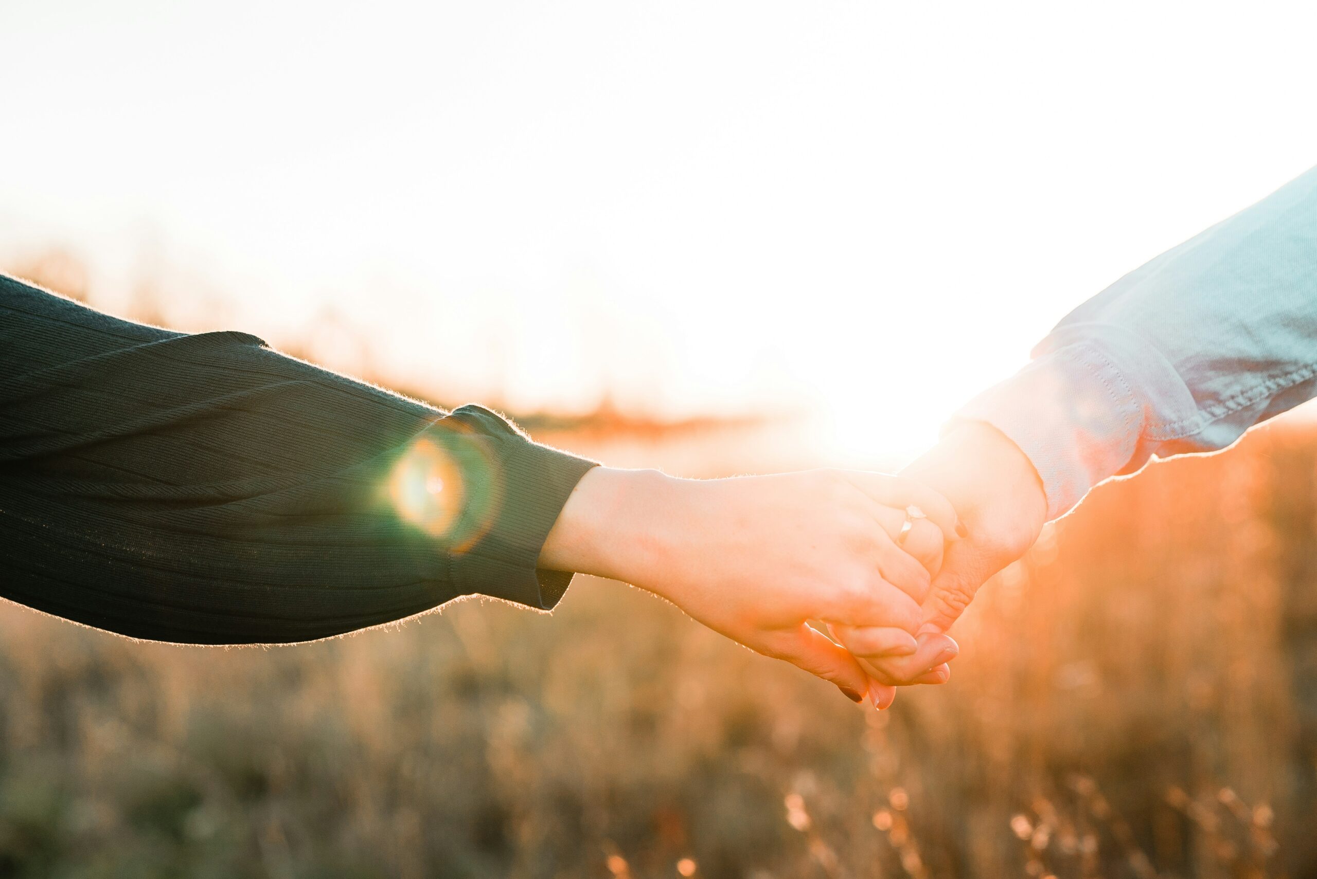 Two people holding hands